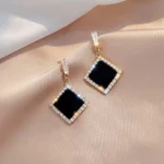 Diamond Black Drop Earrings with Golden Outline